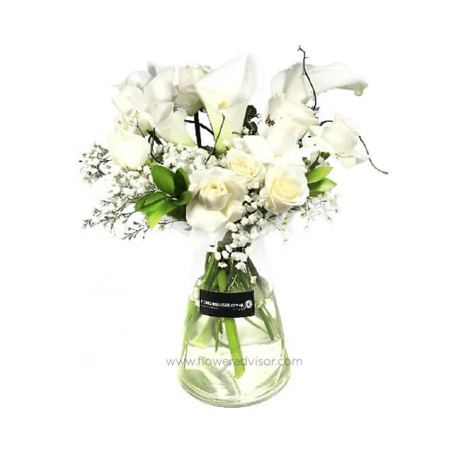 Elegant white flower bouquet in glass vase for flower delivery Singapore