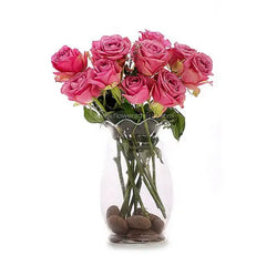Pink roses in a clear glass vase, perfect for same-day flower delivery in Singapore
