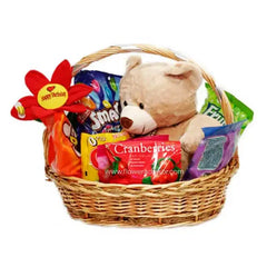 Gift basket for flower delivery with teddy bear, snacks, candy, and a birthday flower
