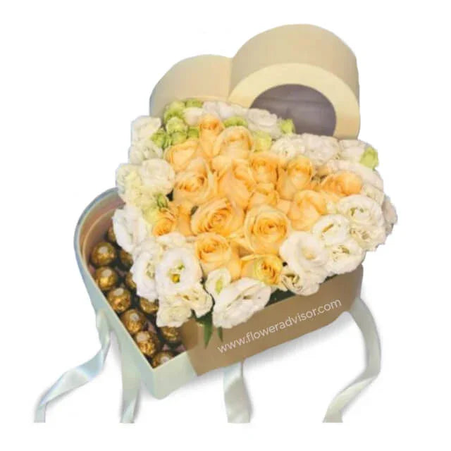 Heart-shaped flower box with cream roses and white blooms for flower delivery in Singapore