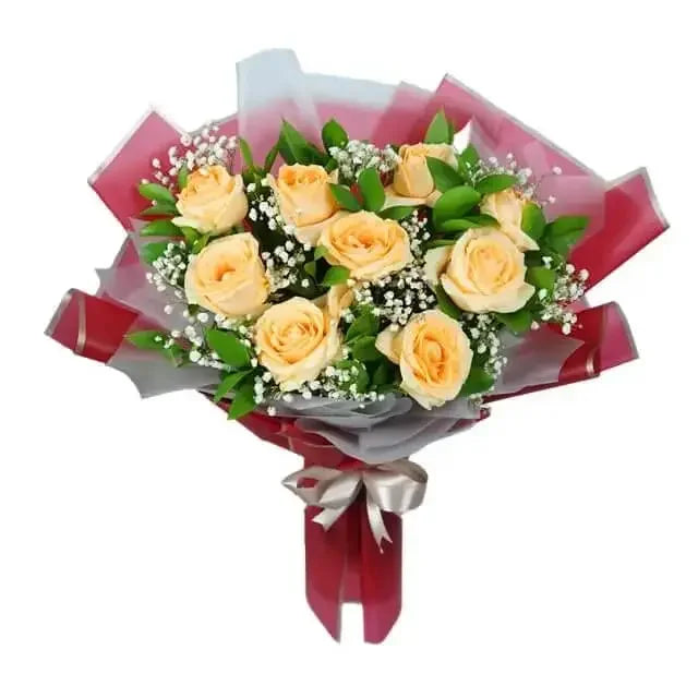Peach rose bouquet with greenery for flower delivery, wrapped in red and white paper