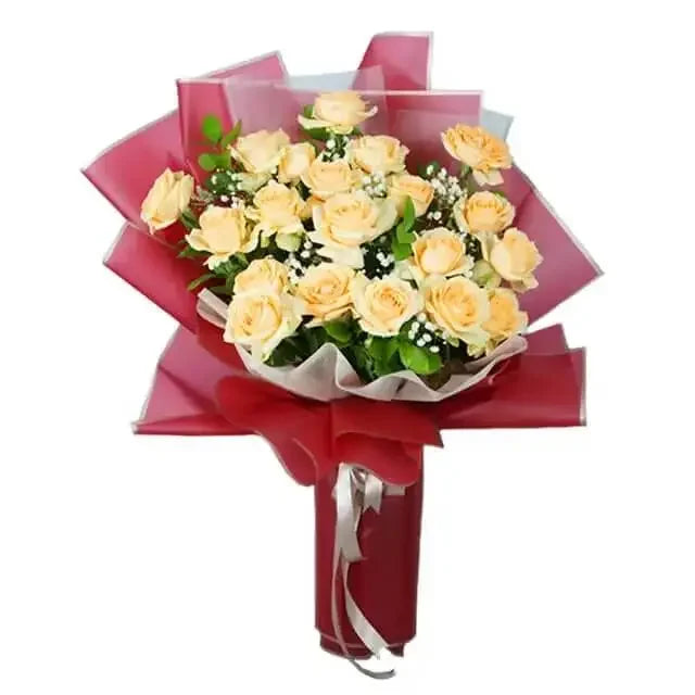 Peach rose bouquet with greenery in red wrapping for flower delivery