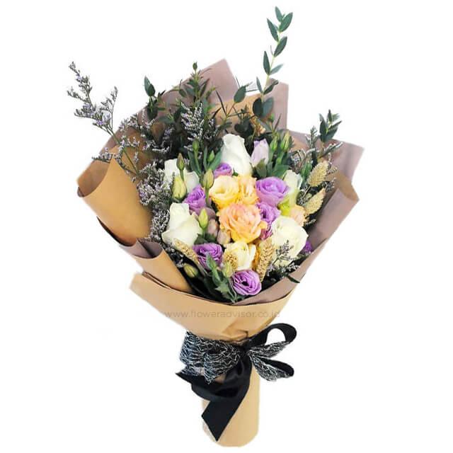 Elegant mixed rose bouquet with white, champagne, and purple flowers for flower delivery