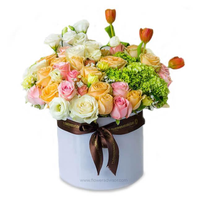 Mixed roses, hydrangeas, and carnations in a hat box for flower delivery in Singapore
