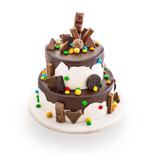 Two-tier chocolate cake with assorted candies, ideal for birthday flower delivery gifts
