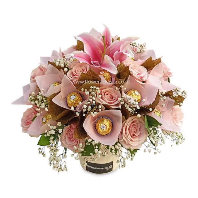 Pink rose and lily vase arrangement with chocolates for flower delivery in Singapore