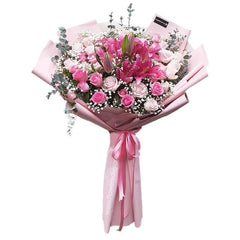Hand bouquet of 40 pink roses and lilies, wrapped for flower delivery in Singapore