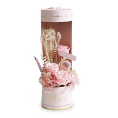 Elegant pink preserved roses and hydrangeas in a gift box for flower delivery