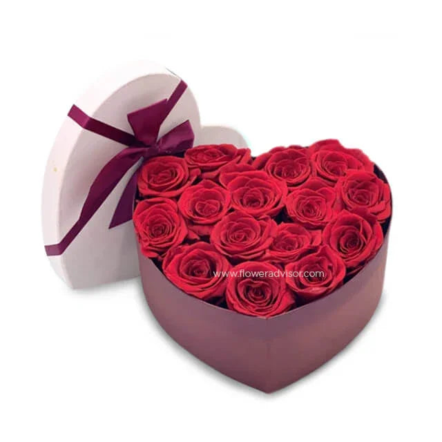 Heart-shaped box of preserved red roses, perfect for romantic flower delivery