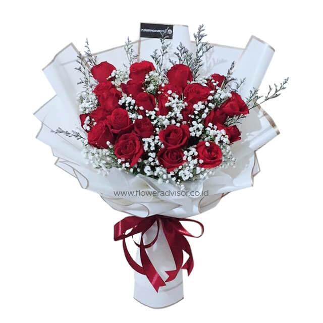 Hand bouquet of 23 red roses with white baby’s breath, perfect for romantic flower delivery.