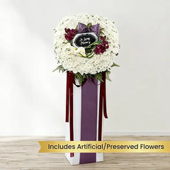 Elegant flower delivery stand with white chrysanthemums, calla lilies, and purple accents