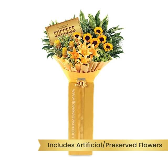 Yellow flower bouquet with sunflowers and lilies for flower delivery, wrapped for gifting