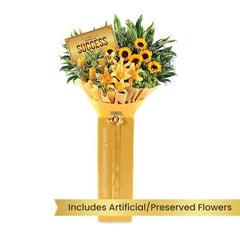 Yellow flower bouquet with sunflowers and lilies for flower delivery, wrapped for gifting