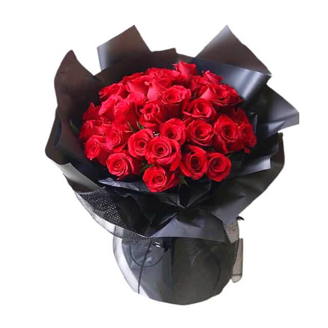 Luxury bouquet of 36 red roses in black wrapping, perfect for flower delivery in Singapore