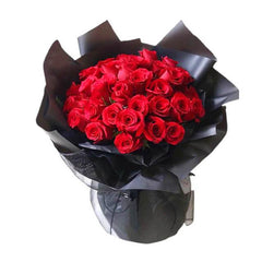 Luxury bouquet of 36 red roses in black wrapping, perfect for flower delivery in Singapore