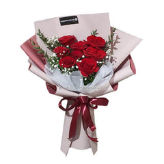 Hand bouquet of 8 fresh red roses with greenery and baby’s breath for flower delivery