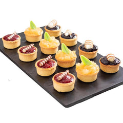 Assorted festive tarts on a platter, ideal for flower delivery gift sets in Singapore
