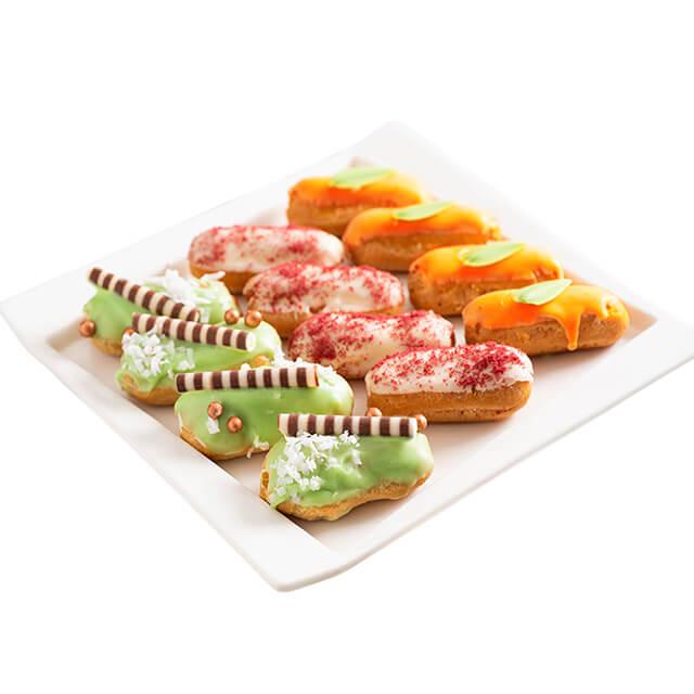 Colorful assorted eclairs on a plate, perfect as a gift with flower delivery in Singapore