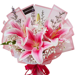 Elegant pink lily bouquet with baby's breath, perfect for flower delivery in Singapore