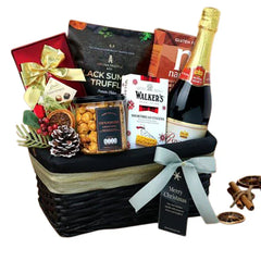 Festive hamper with gourmet snacks, chocolates, wine and holiday flowers for gift delivery