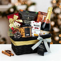 Festive Christmas hamper with gourmet treats, wine, and holiday accents for flower delivery gifts