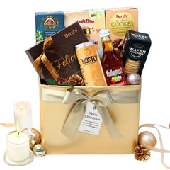 Festive hamper with chocolates, cookies, tea, and seasonal flowers for delivery in Singapore
