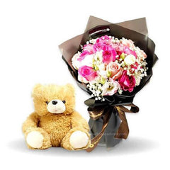 Flower delivery of pink roses and white eustomas bouquet with teddy bear gift