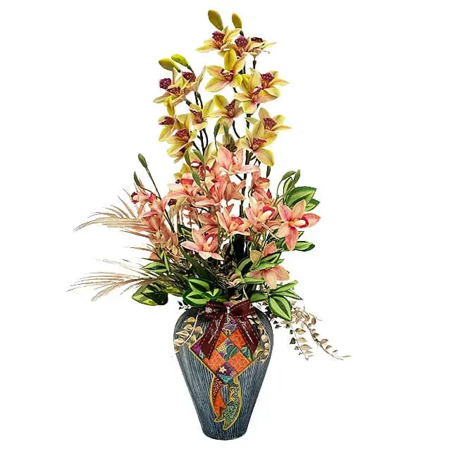 Elegant flower arrangement with pink and yellow orchids in a decorative vase for delivery
