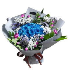 Elegant flower bouquet with blue roses, pink and white flowers, perfect for flower delivery