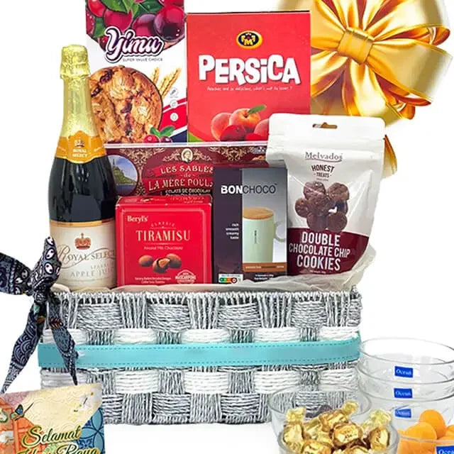 Festive gift hamper with cookies, tiramisu, chocolates, and sparkling drink for flower delivery