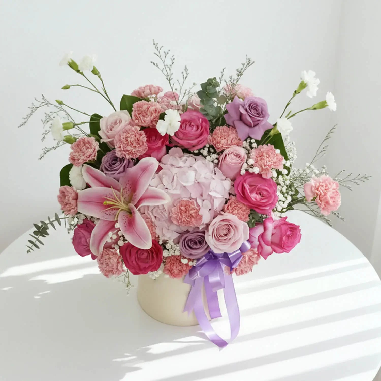 Elegant flower arrangement with pink lilies, roses, carnations for Singapore flower delivery