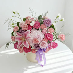 Elegant flower arrangement with pink lilies, roses, carnations for Singapore flower delivery