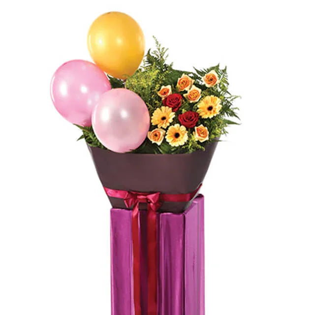 Colorful flower bouquet with balloons in a gift box for flower delivery
