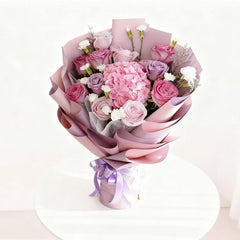Elegant pink and purple flower bouquet for delivery, featuring roses and hydrangeas