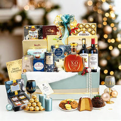 Festive hamper with chocolate, wine, brandy, and treats, ideal for flower delivery gift.
