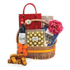 Flower delivery gift basket with wine, chocolates, mooncakes, pink peony and red bag