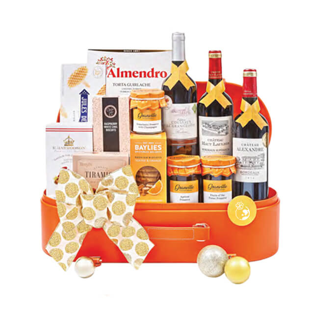 Luxury gift hamper with wine, cookies, and festive treats for flower delivery gifting
