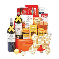 Elegant flower delivery gift hamper with Bordeaux wine, cookies, snacks, and festive ribbon