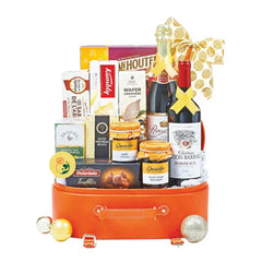 Gourmet flower delivery hamper with wine, snacks, and festive gift items