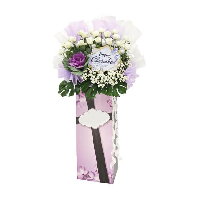 Condolence flower stand with white roses, purple and white blooms, for flower delivery