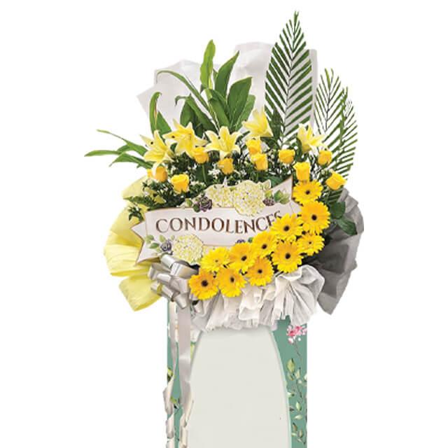 Condolence flower stand with fresh yellow flowers for sympathy flower delivery