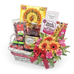 Fresh flower bouquet and gourmet gift basket with cereal, juice, and snacks for delivery