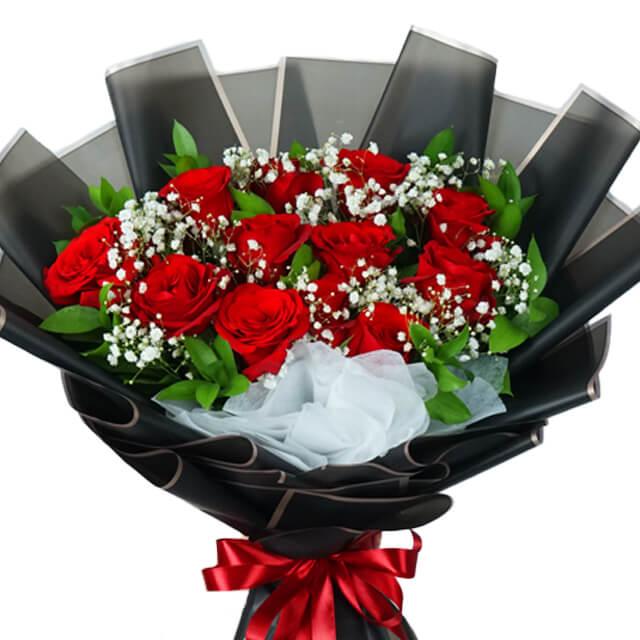 Red rose bouquet with baby's breath, black wrapping, ideal for flower delivery in Singapore