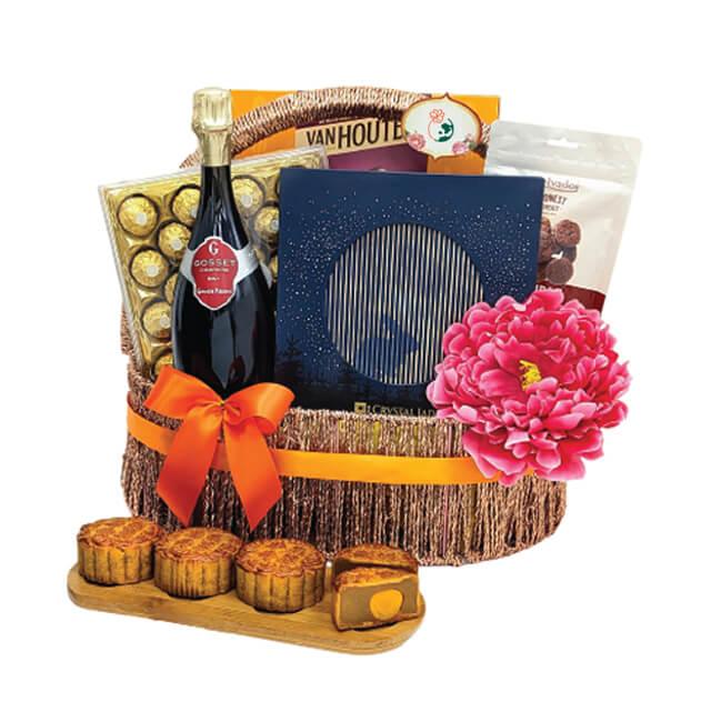 Elegant gift basket with pink flower, baked treats, wine, chocolates, perfect for flower delivery