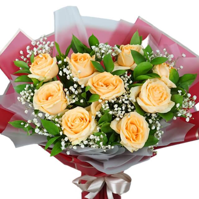Elegant bouquet of pale yellow roses with baby's breath and greenery for flower delivery