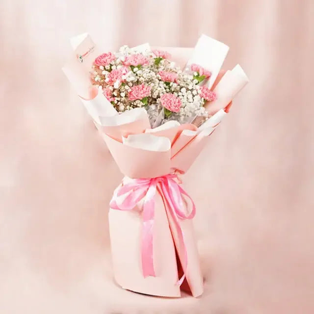 Pink carnation bouquet with baby’s breath, gift-wrapped for flower delivery in Singapore