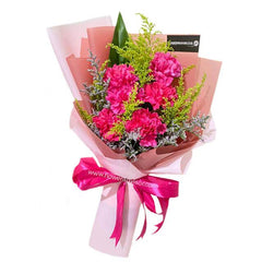 Bright pink carnation bouquet with greenery, perfect for same-day flower delivery in Singapore