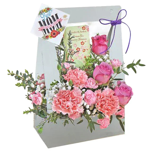 Flower delivery of a pink bloom box with roses, carnations, and a best mom card