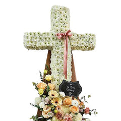 Flower delivery cross-shaped funeral wreath with white and pastel flowers