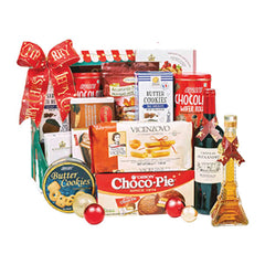 Festive gift hamper with cookies, chocolate, and Eiffel Tower shaped bottle, ideal for flower delivery gifts